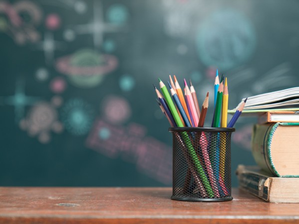 school-books-on-desk--education-concept-871454068-5b548900c9e77c005b04fc8c.jpg